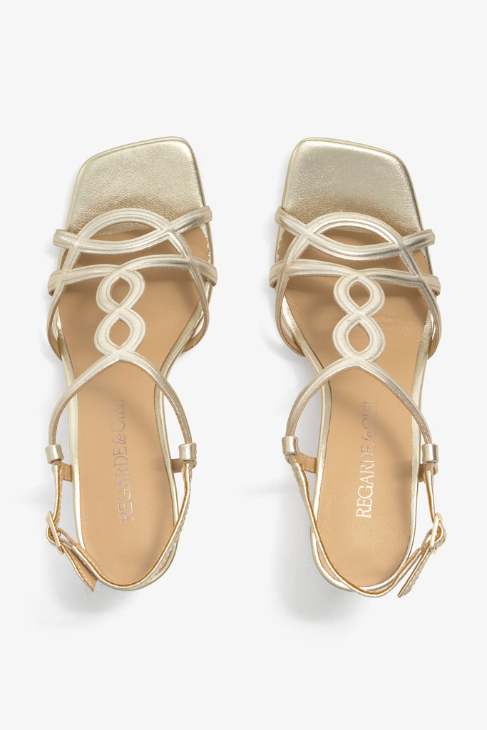 CHELLY-01 wingtip-heel sandal in platino leather with decorative heel