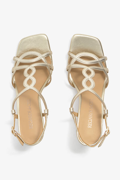 CHELLY-01 wingtip-heel sandal in platino leather with decorative heel