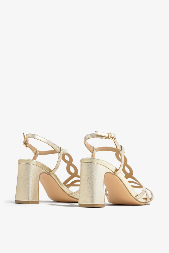 CHELLY-01 wingtip-heel sandal in platino leather with decorative heel