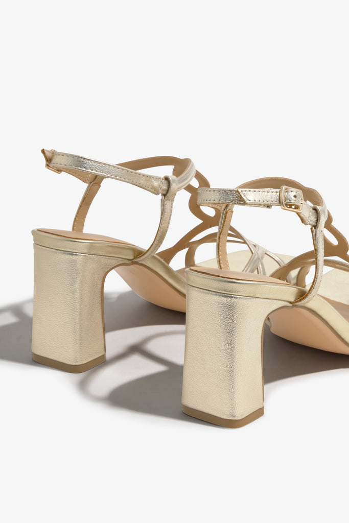 CHELLY-01 wingtip-heel sandal in platino leather with decorative heel