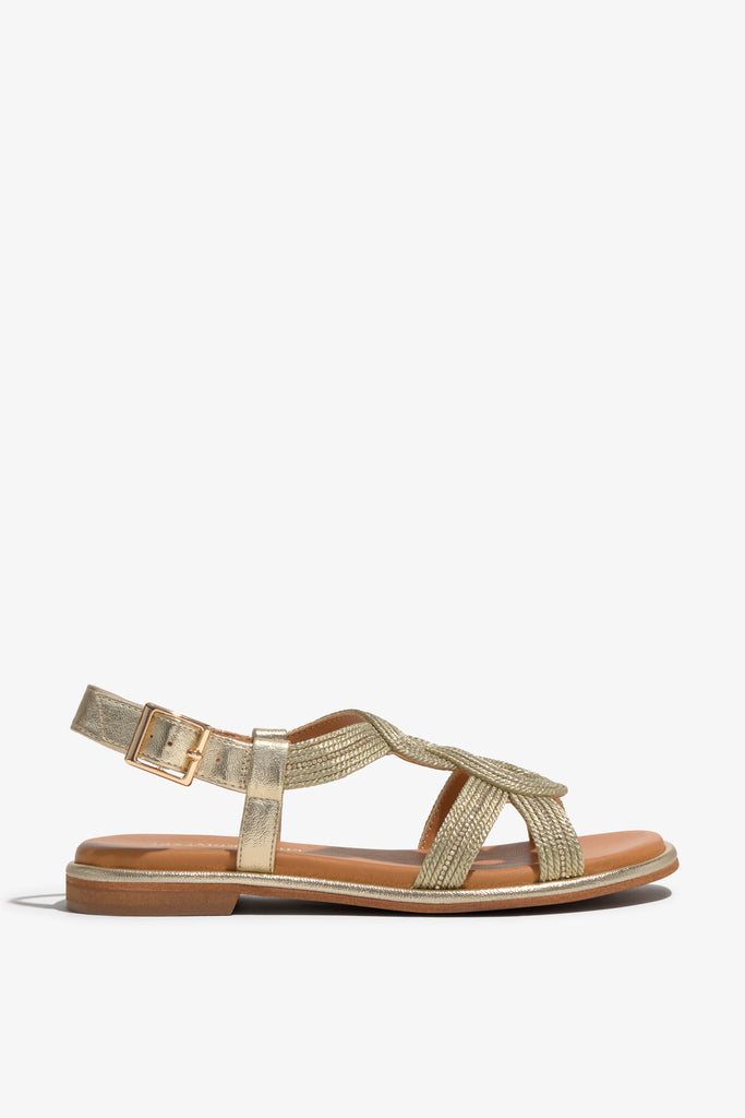 Women's flat gold strappy sandal with metallic woven details and ankle buckle strap.