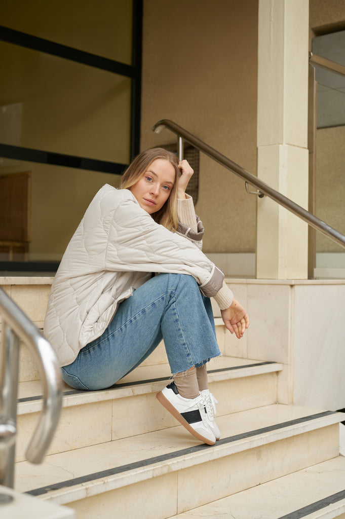 Grisel-01 white leather sneakers by Regarde Le Ciel with black side panel, beige suede toe, black heel tab, and gum sole.