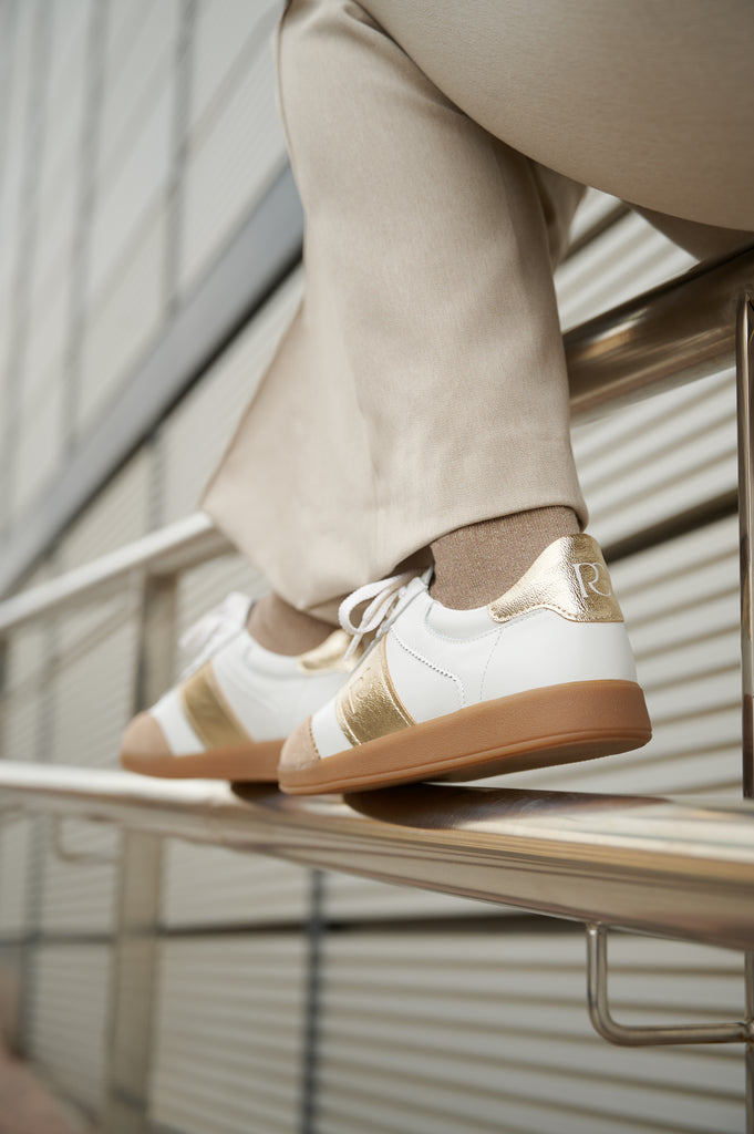 Grisel-01 white leather sneakers by Regarde Le Ciel with gold platino side panel, beige suede toe, gold platino heel tab, and gum sole.