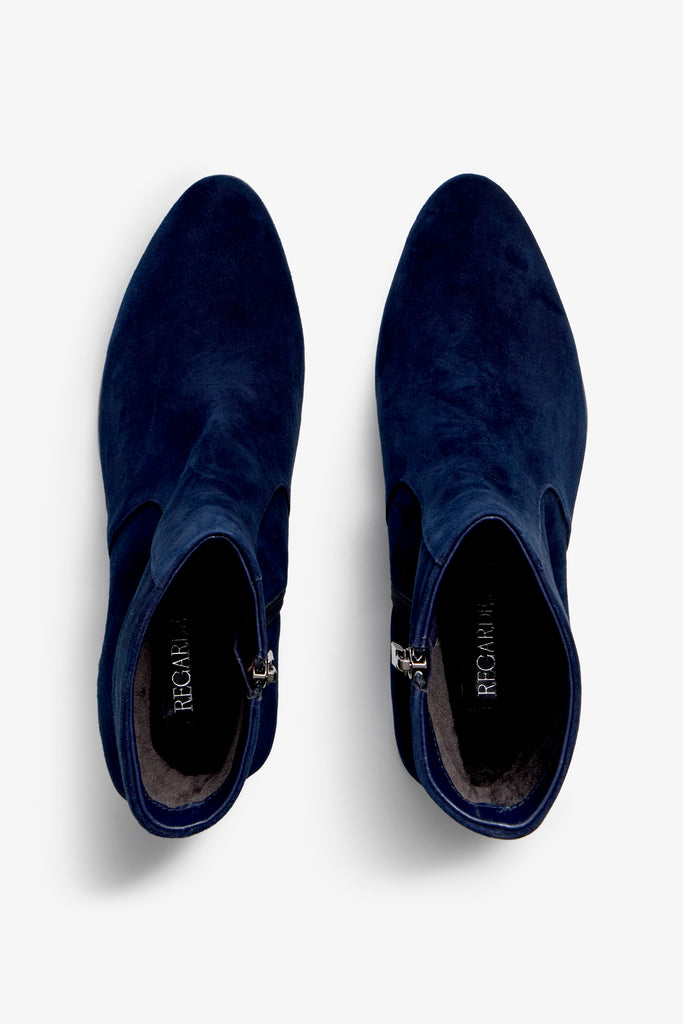 navy suede ankle boot features 60mm heel, zipper, accentuated stitching, rubber sole, naplak block heel and memory foam footbed.
