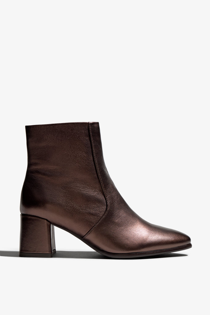 ebano metallic ankle boot features 60mm heel, zipper, accentuated stitching, rubber sole, block heel and memory foam footbed.