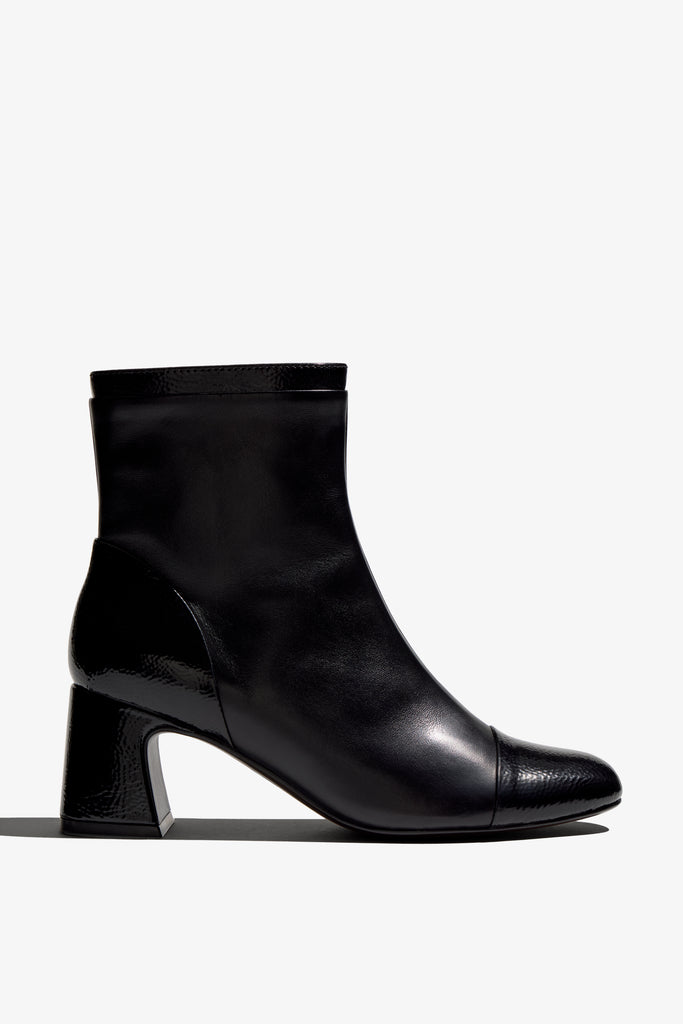 Black ankle boot, 60mm heel, zipper, accentuated stitching, rubber sole, and memory foam footbed.