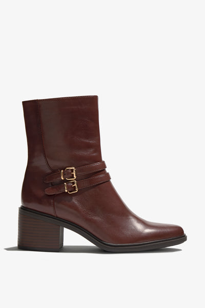 Castagno dark brown leather bootie with 60 mm block heel, two leather buckle straps, accentuated stitching and zipper, rubber sole.