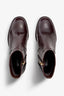 castagno dark brown leather ankle boot features a 65 mm heel, zipper, accentuated stitching, rubber sole, and plateau.