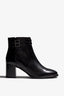 black leather ankle boot features a 65 mm heel, zipper, accentuated stitching, rubber sole, plateau and buckle straps.