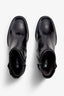 black leather ankle boot features a 65 mm heel, zipper, accentuated stitching, rubber sole, plateau and buckle straps.