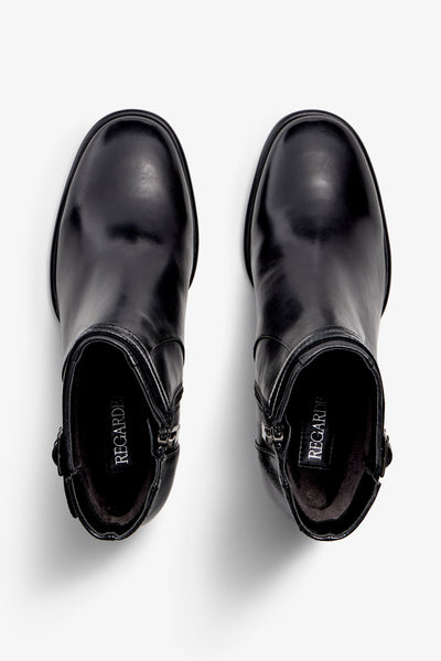 black leather ankle boot features a 65 mm heel, zipper, accentuated stitching, rubber sole, plateau and buckle straps.