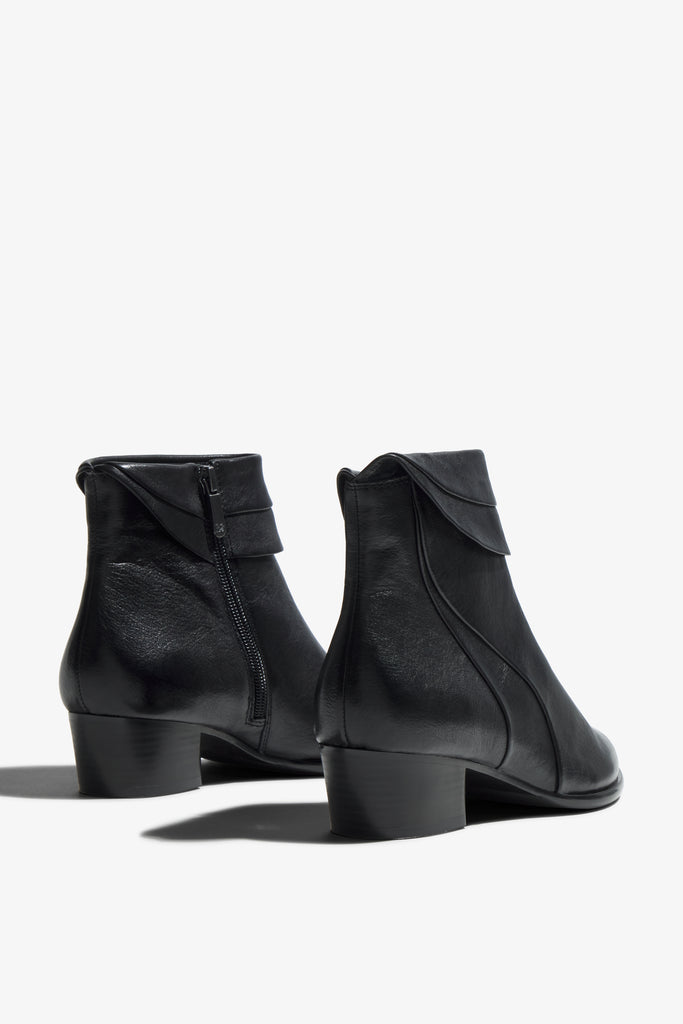 Lori black leather knee-high boot with ruched upper showing interior - top view