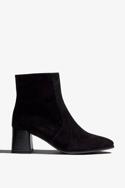 black suede ankle boot features 60mm heel, zipper, accentuated stitching, rubber sole, naplak block heel and memory foam footbed.