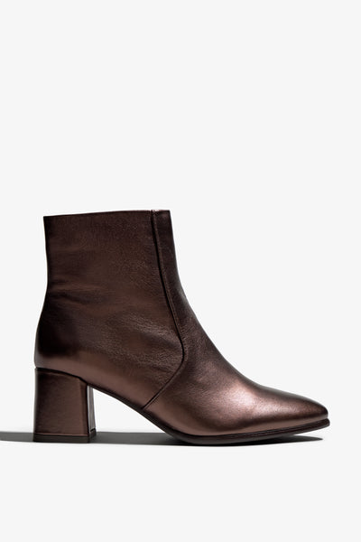 ebano metallic ankle boot features 60mm heel, zipper, accentuated stitching, rubber sole, block heel and memory foam footbed.