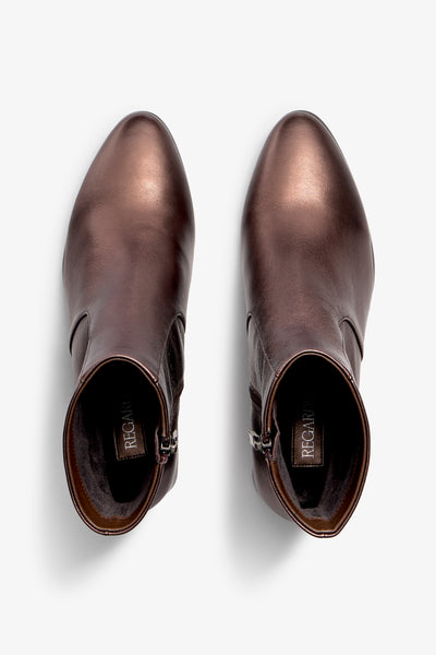 ebano metallic ankle boot features 60mm heel, zipper, accentuated stitching, rubber sole, block heel and memory foam footbed.