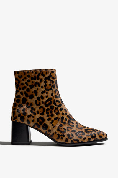 leopard print ankle boot features 60mm heel, zipper, accentuated stitching, rubber sole, block heel and memory foam footbed.