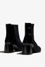 black leather stretch ankle boot features 60mm heel, zipper, accentuated stitching, rubber sole, block heel and memory foam footbed.