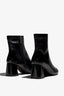 Black ankle boot, 60mm heel, zipper, accentuated stitching, rubber sole, and memory foam footbed.