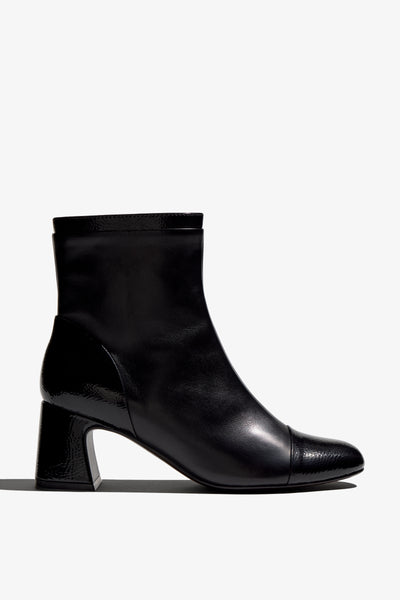 Black ankle boot, 60mm heel, zipper, accentuated stitching, rubber sole, and memory foam footbed.