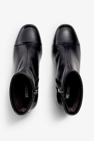 Black ankle boot, 60mm heel, zipper, accentuated stitching, rubber sole, and memory foam footbed.
