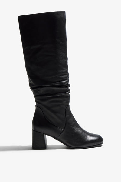 Neva black leather knee-high boot with ruched shaft and block heel - side view