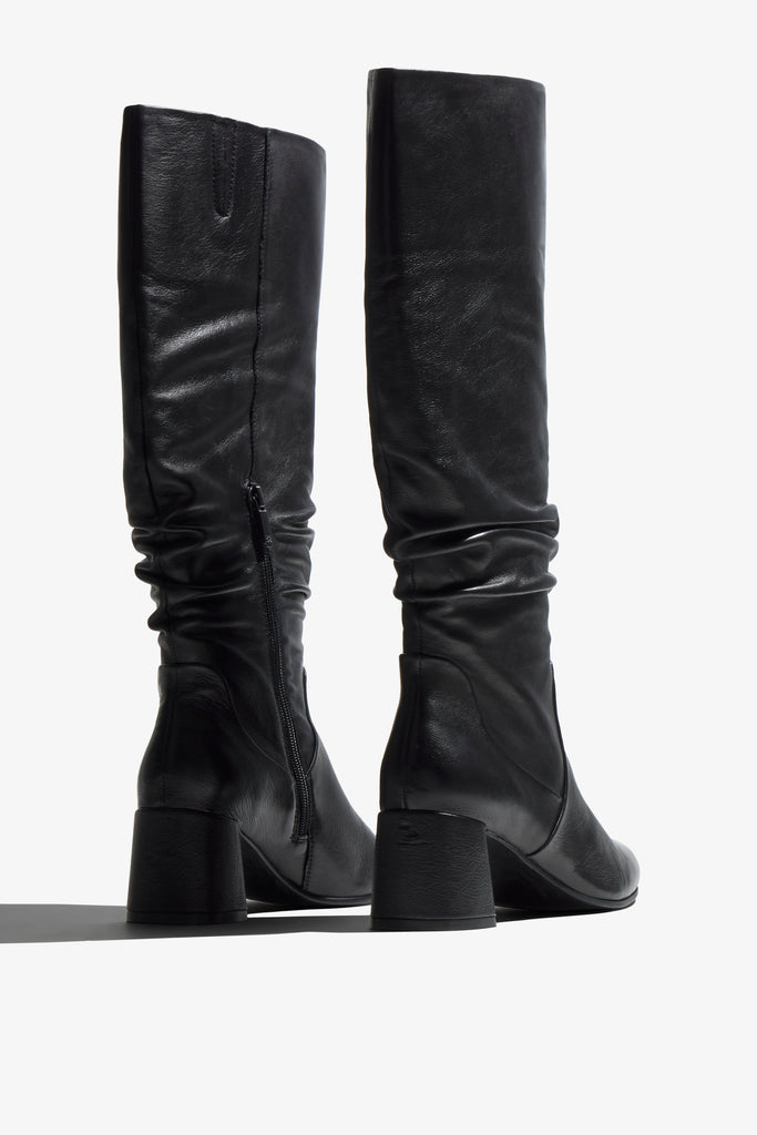 Neva black leather knee-high boot with ruched shaft showing interior - top view