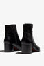 black leather ankle bootie, 60 mm, zipper, stretch upper material, accentuated stitching, block heel, rubber sole.