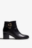 black leather ankle bootie, 60 mm, zipper, buckles and metal accessories, accentuated stitching, block heel, rubber sole.