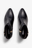 black leather ankle bootie, 60 mm, zipper, buckles and metal accessories, accentuated stitching, block heel, rubber sole.