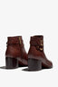 new rust leather ankle bootie, 60 mm, zipper, buckles and metal accessories, accentuated stitching, block heel, rubber sole.
