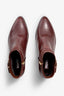 new rust leather ankle bootie, 60 mm, zipper, buckles and metal accessories, accentuated stitching, block heel, rubber sole.
